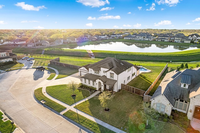 bird's eye view with a residential view and a water view