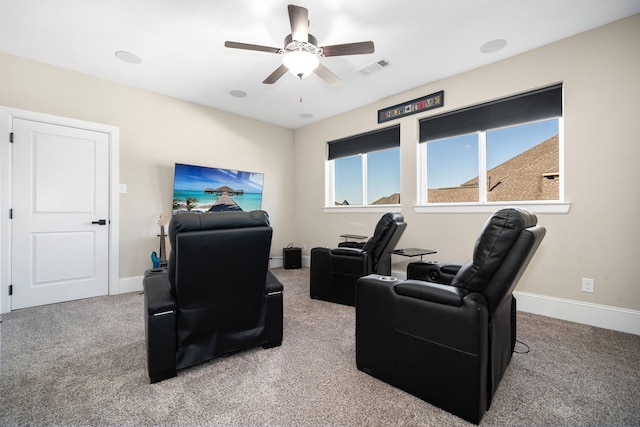 cinema with visible vents, ceiling fan, baseboards, and carpet