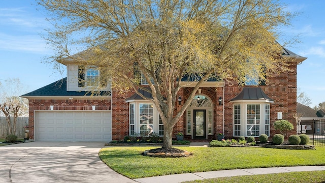 view of front of home featuring a front lawn, fence, concrete driveway, a garage, and brick siding