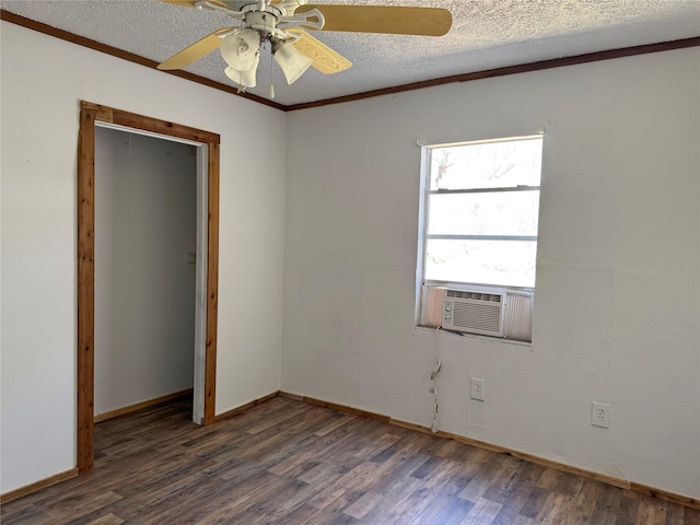 spare room featuring baseboards, a textured ceiling, a ceiling fan, and wood finished floors