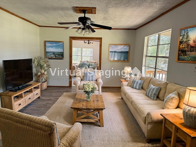 living area featuring a healthy amount of sunlight, crown molding, and ceiling fan