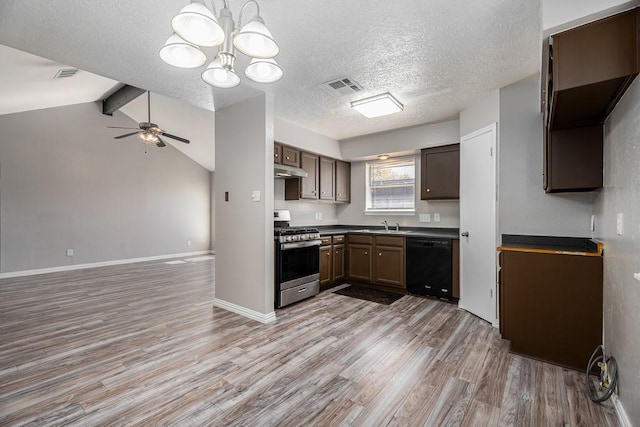 kitchen featuring visible vents, under cabinet range hood, open floor plan, gas stove, and dishwasher