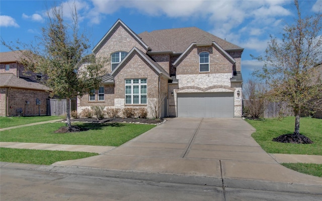 view of front of home with a front yard, fence, and brick siding