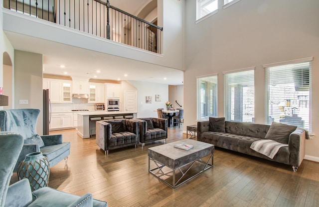 living area with recessed lighting and light wood-type flooring