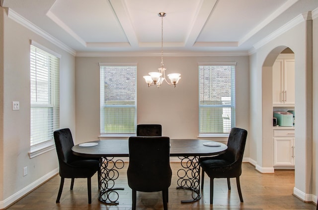 dining room featuring baseboards, an inviting chandelier, and wood finished floors