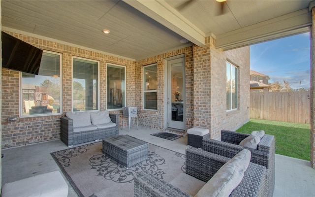 view of patio with an outdoor hangout area and fence