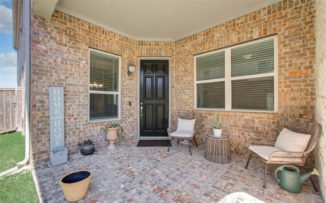 entrance to property with brick siding