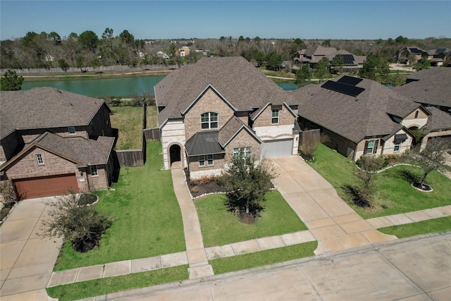 bird's eye view with a residential view and a water view