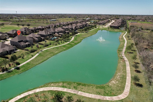 bird's eye view with a residential view and a water view