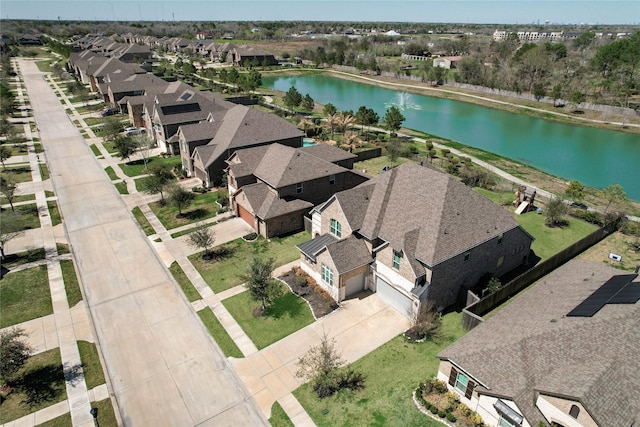 aerial view featuring a residential view and a water view