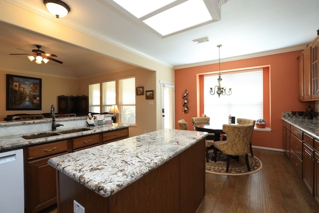 9407 Thurber Ridge Dr, Spring, TX 77379 - kitchen featuring a sink, white dishwasher, dark wood-style floors, a center island, and light stone countertops