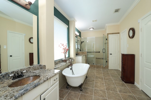 9407 Thurber Ridge Dr, Spring, TX 77379 - bathroom featuring a stall shower, a soaking tub, ornamental molding, vanity, and tile patterned floors