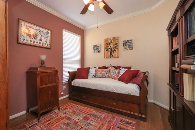 9407 Thurber Ridge Dr, Spring, TX 77379 - bedroom featuring ornamental molding, dark wood-style flooring, baseboards, and a ceiling fan