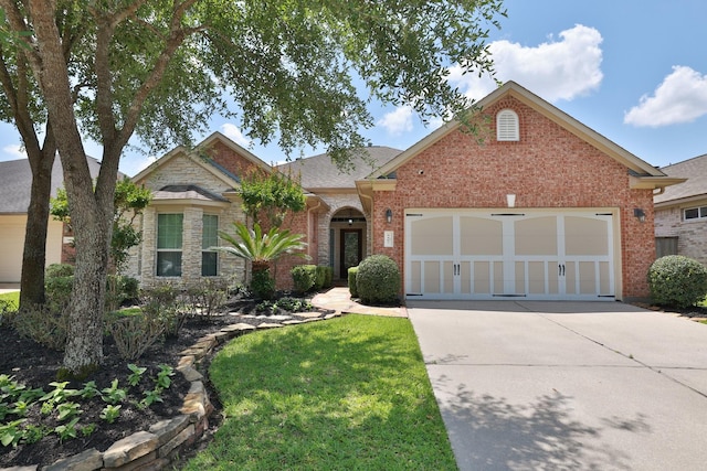 9407 Thurber Ridge Dr, Spring, TX 77379 - traditional-style house featuring driveway, a garage, brick siding, and a front lawn