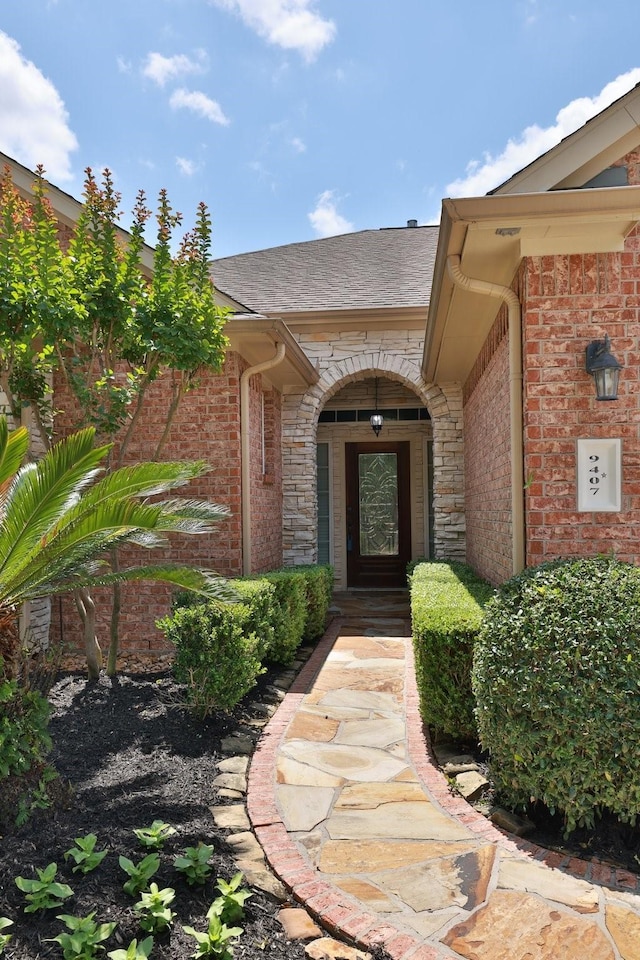 9407 Thurber Ridge Dr, Spring, TX 77379 - property entrance featuring brick siding and roof with shingles