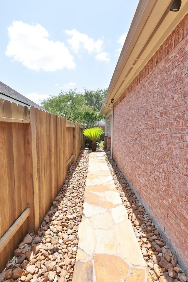 9407 Thurber Ridge Dr, Spring, TX 77379 - view of side of home featuring fence and brick siding