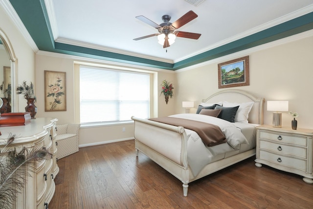 9407 Thurber Ridge Dr, Spring, TX 77379 - bedroom with dark wood-style flooring, crown molding, baseboards, a ceiling fan, and a tray ceiling