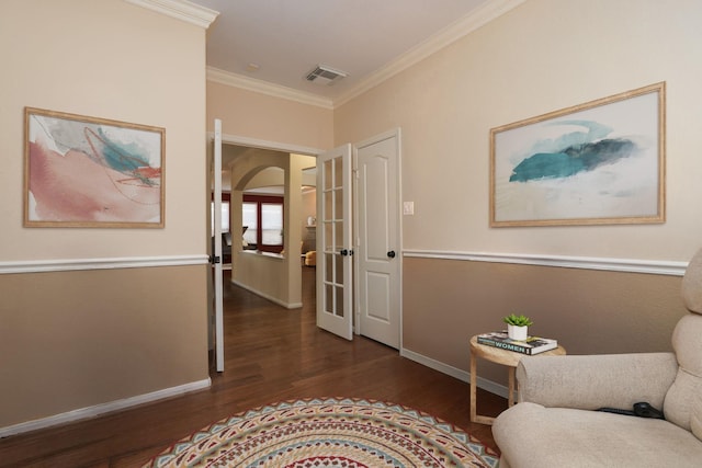 9407 Thurber Ridge Dr, Spring, TX 77379 - sitting room featuring dark wood finished floors, crown molding, baseboards, arched walkways, and french doors