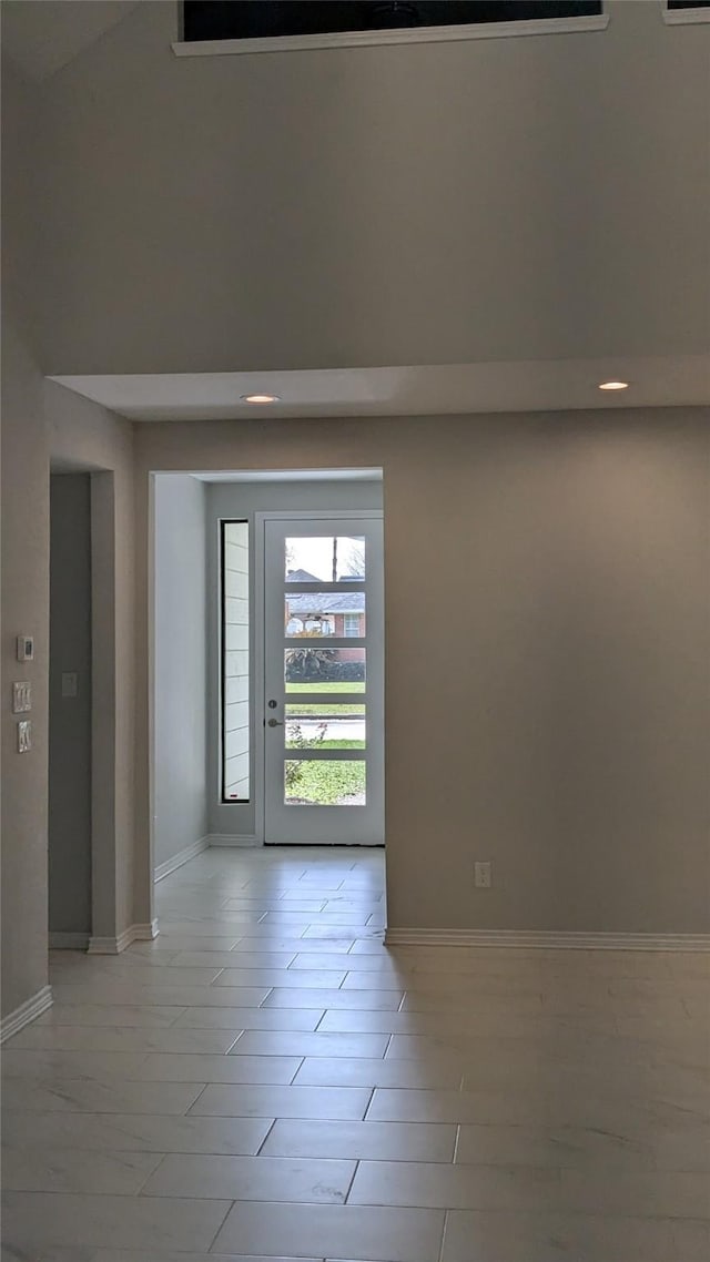 empty room featuring baseboards