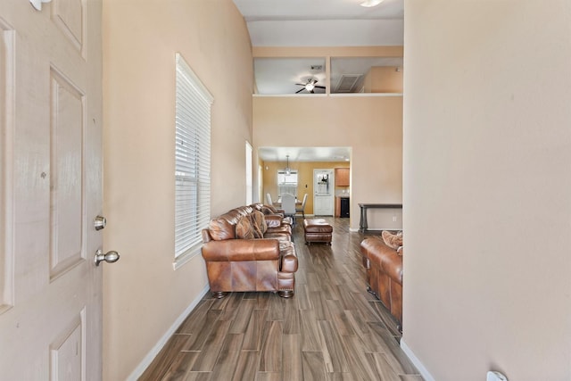 foyer entrance with baseboards and wood finished floors