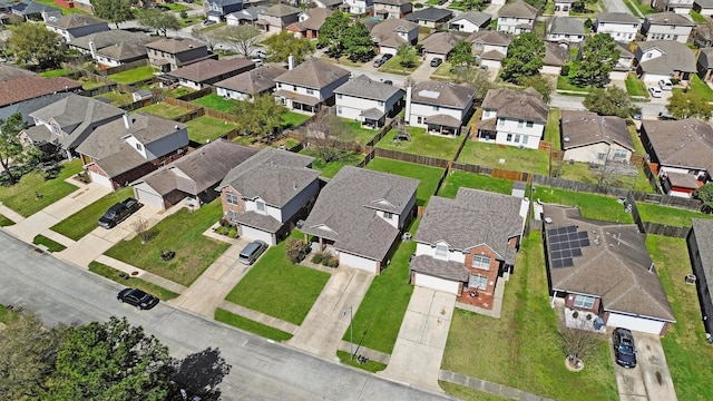 birds eye view of property with a residential view