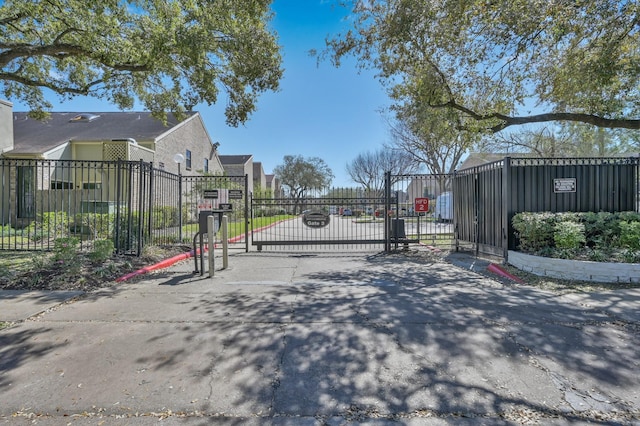 view of gate with fence