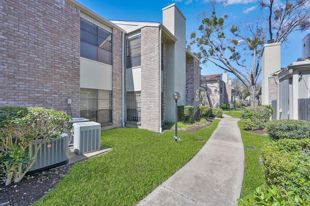 view of home's community with a lawn