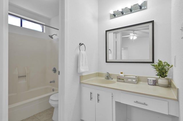 full bathroom featuring tile patterned flooring, ceiling fan, washtub / shower combination, toilet, and vanity