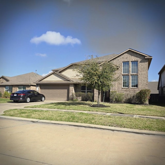 view of front facade featuring brick siding, an attached garage, concrete driveway, and a front yard