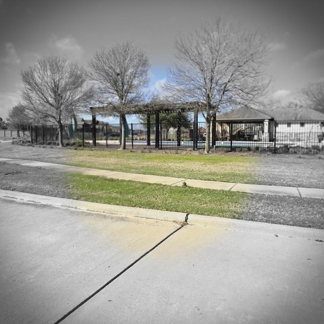 view of home's community featuring a gazebo and fence