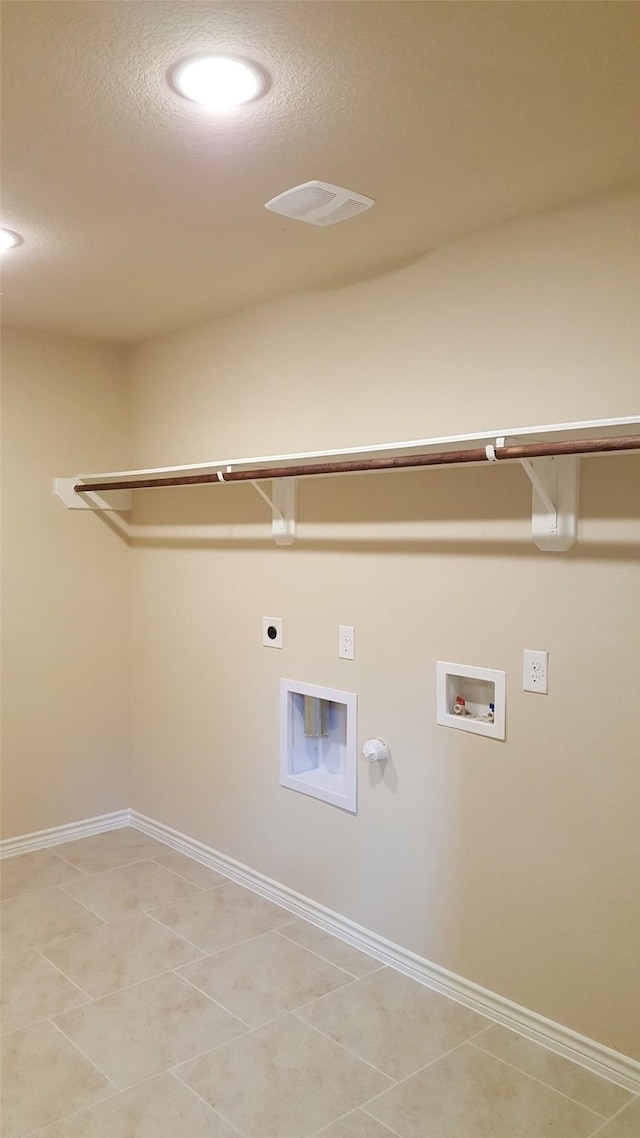 laundry room featuring gas dryer hookup, light tile patterned floors, laundry area, hookup for a washing machine, and electric dryer hookup