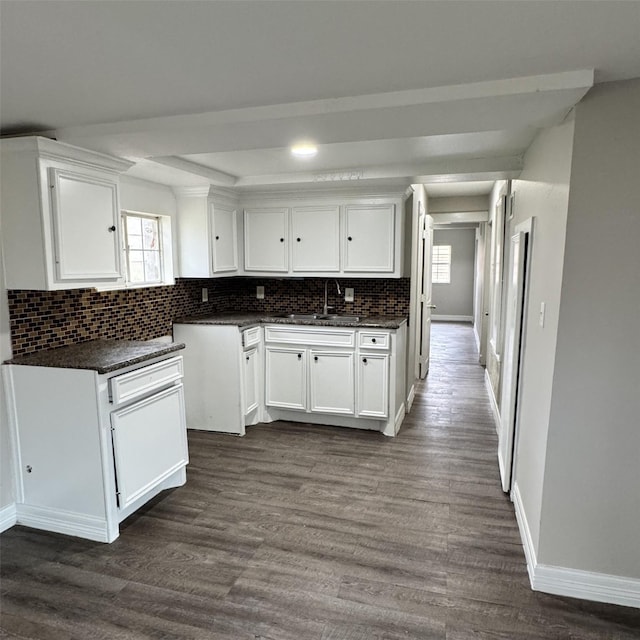 kitchen with dark wood-style floors, plenty of natural light, and white cabinets