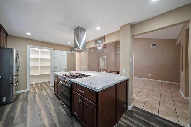 kitchen featuring recessed lighting, visible vents, appliances with stainless steel finishes, and island range hood