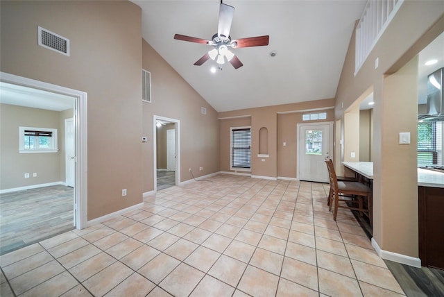 living room featuring high vaulted ceiling, baseboards, visible vents, and ceiling fan