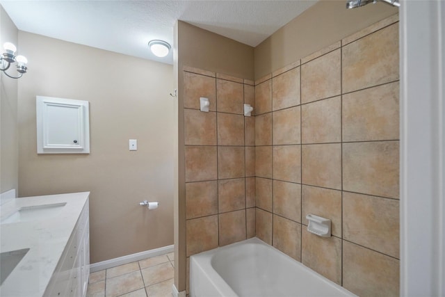 bathroom featuring vanity, tile patterned floors, tub / shower combination, and baseboards