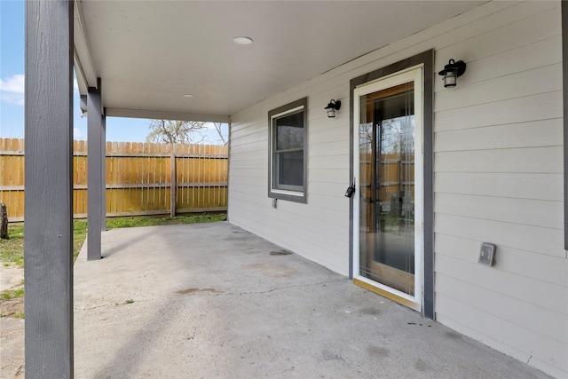 view of patio featuring fence