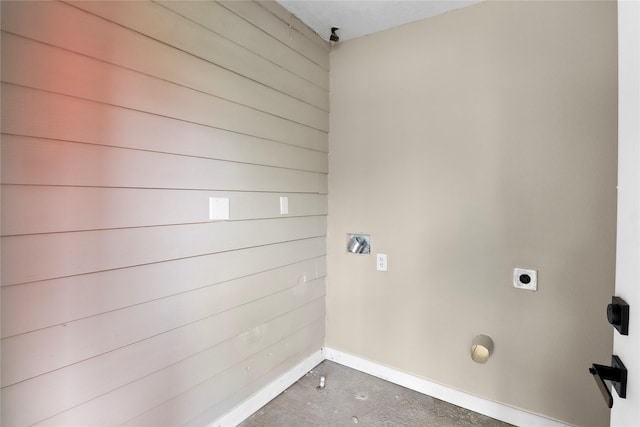 laundry room with electric dryer hookup, baseboards, and laundry area