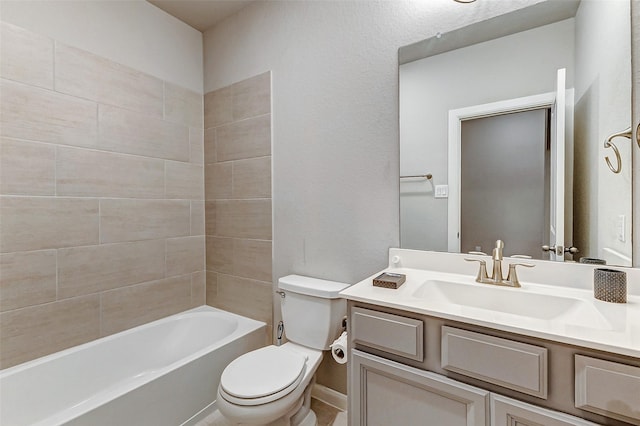 bathroom featuring toilet, bathtub / shower combination, and vanity