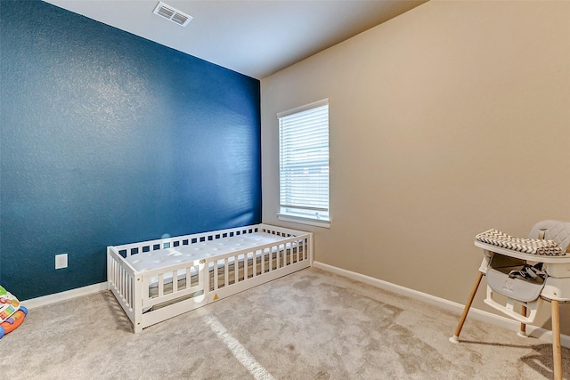 bedroom with visible vents, baseboards, and carpet floors