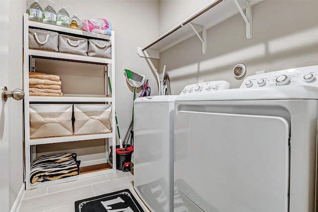 laundry area with washing machine and clothes dryer and laundry area