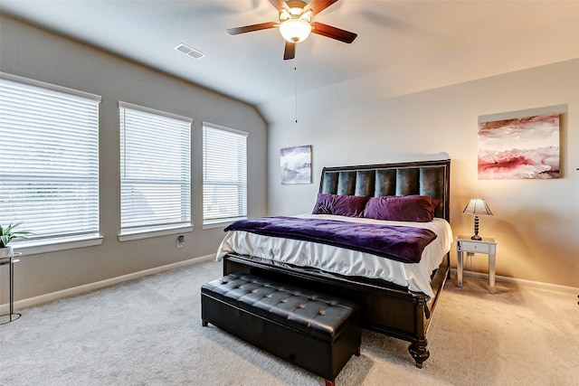 bedroom with visible vents, baseboards, carpet floors, lofted ceiling, and ceiling fan