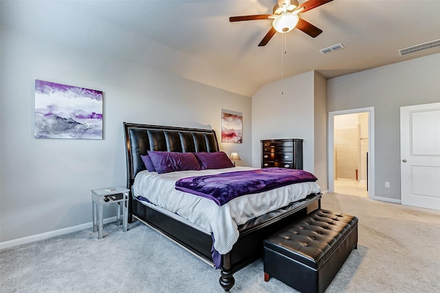 bedroom with light carpet, visible vents, baseboards, and vaulted ceiling