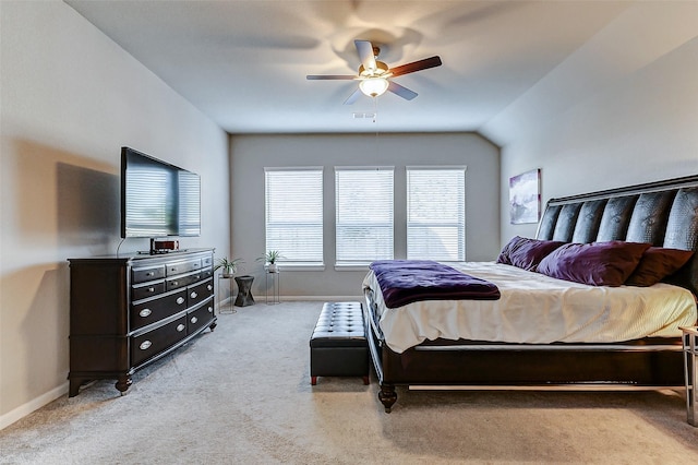 carpeted bedroom with baseboards, visible vents, and ceiling fan