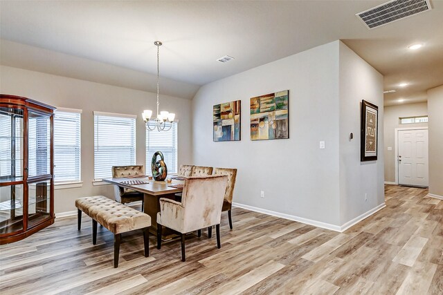 dining room with visible vents and light wood-style flooring