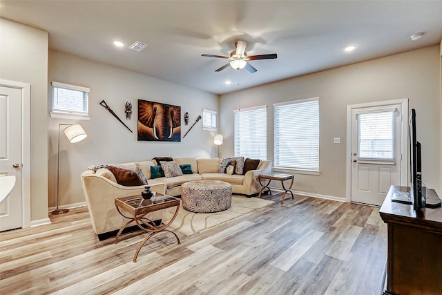 living area featuring visible vents, baseboards, ceiling fan, light wood-type flooring, and recessed lighting