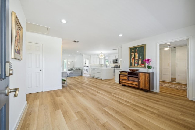 interior space featuring recessed lighting, visible vents, and light wood-style flooring