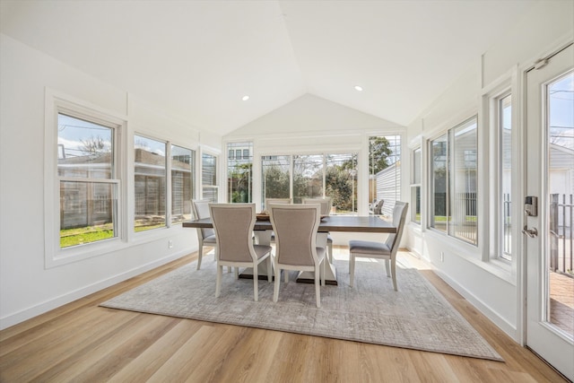 sunroom featuring lofted ceiling