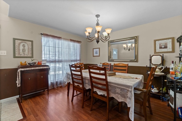 dining room featuring a notable chandelier and wood finished floors