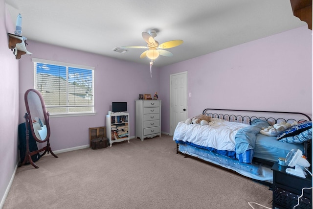 bedroom with baseboards, visible vents, carpet floors, and ceiling fan