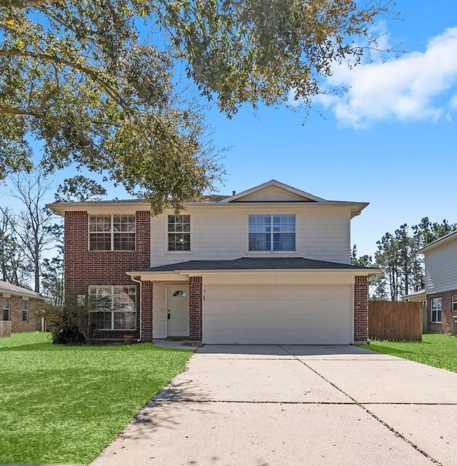 traditional home with brick siding, a garage, concrete driveway, and a front yard